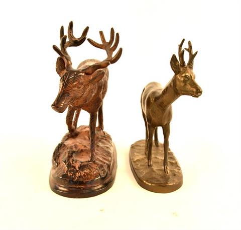 sculptures of red stag and roebuck
