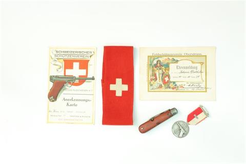 Mixed lot of memorabilia Swiss Army, Luger related *
