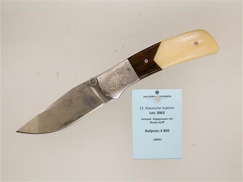 folding knife with two coloured handle